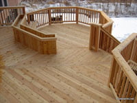 when to stain a new deck